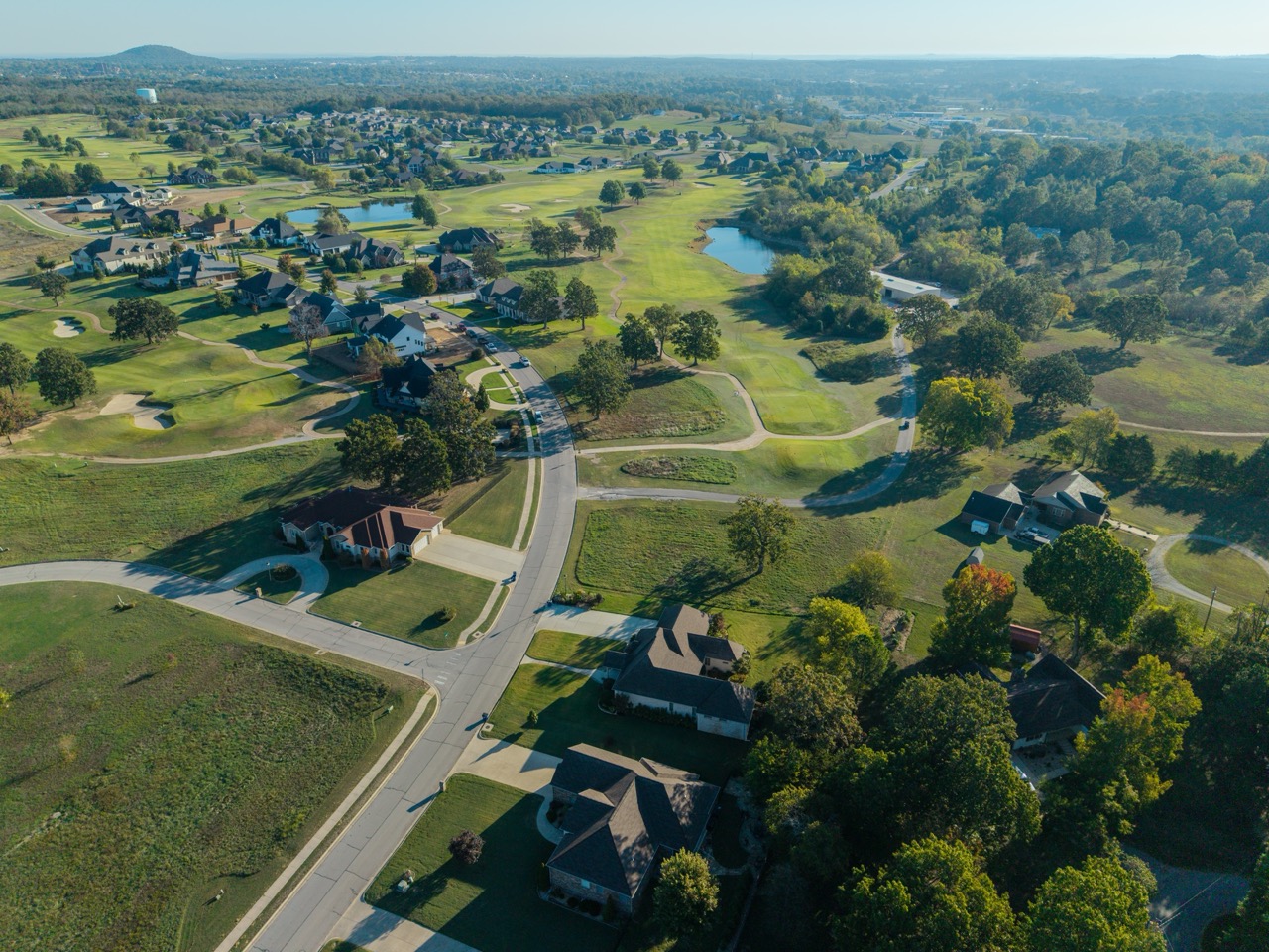 Aerial view of golf course and residential neighborhood.