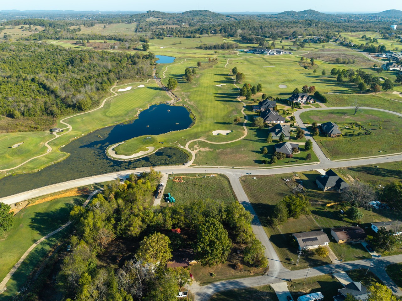 Aerial view of golf course with ponds and sand traps