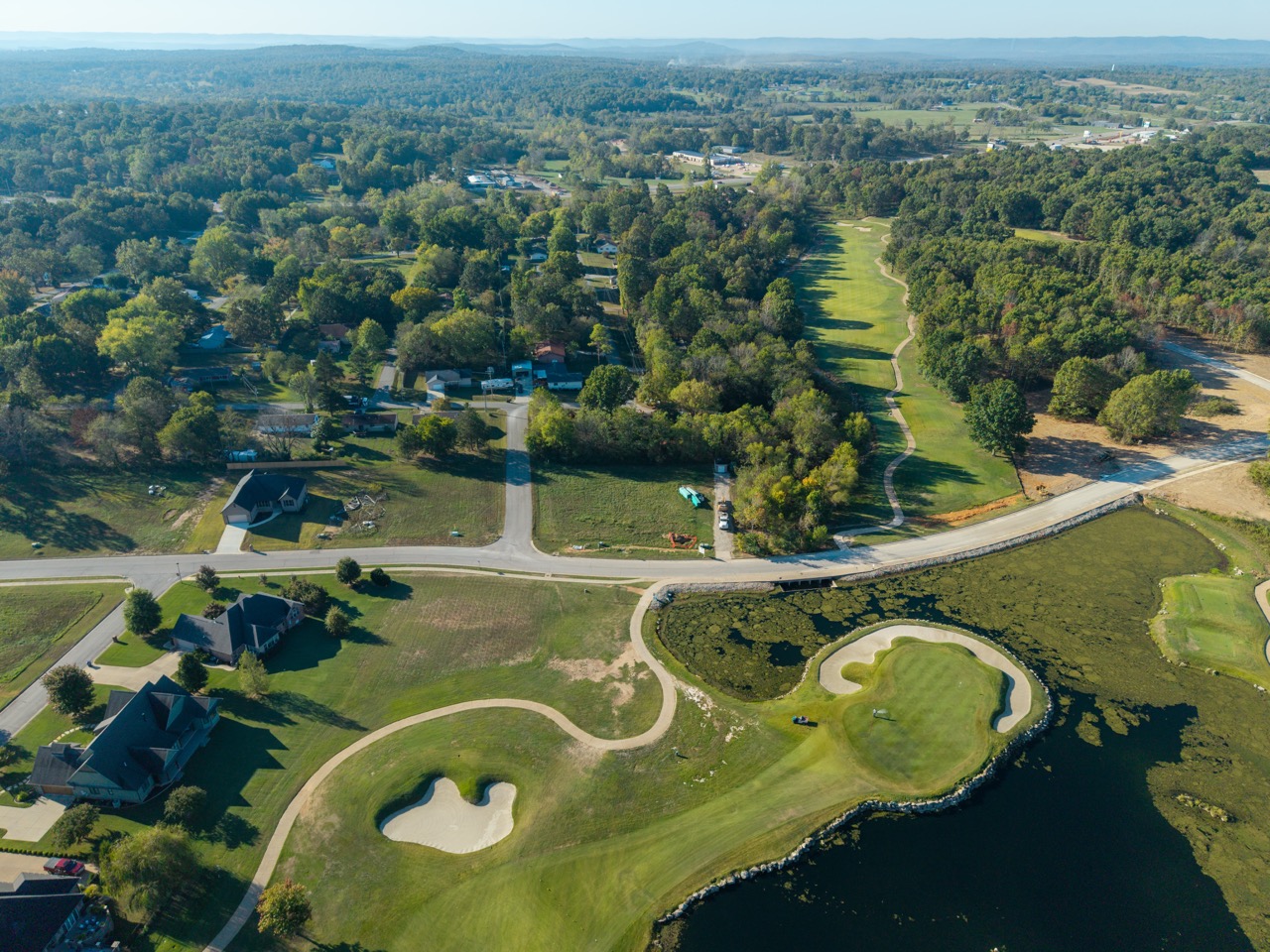 Aerial view of golf course with water hazard