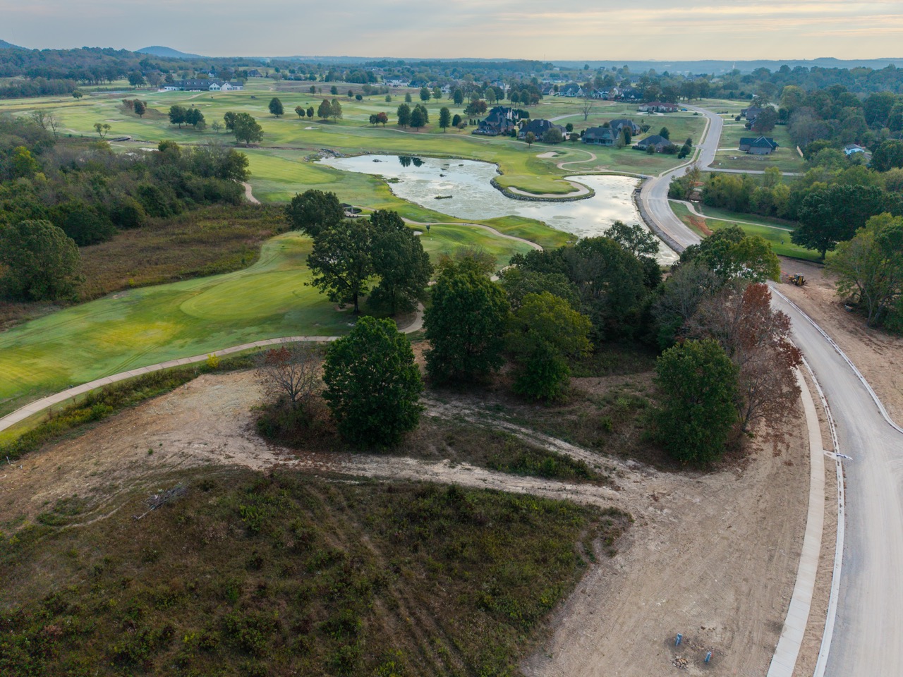 golf course with ponds and winding fairways