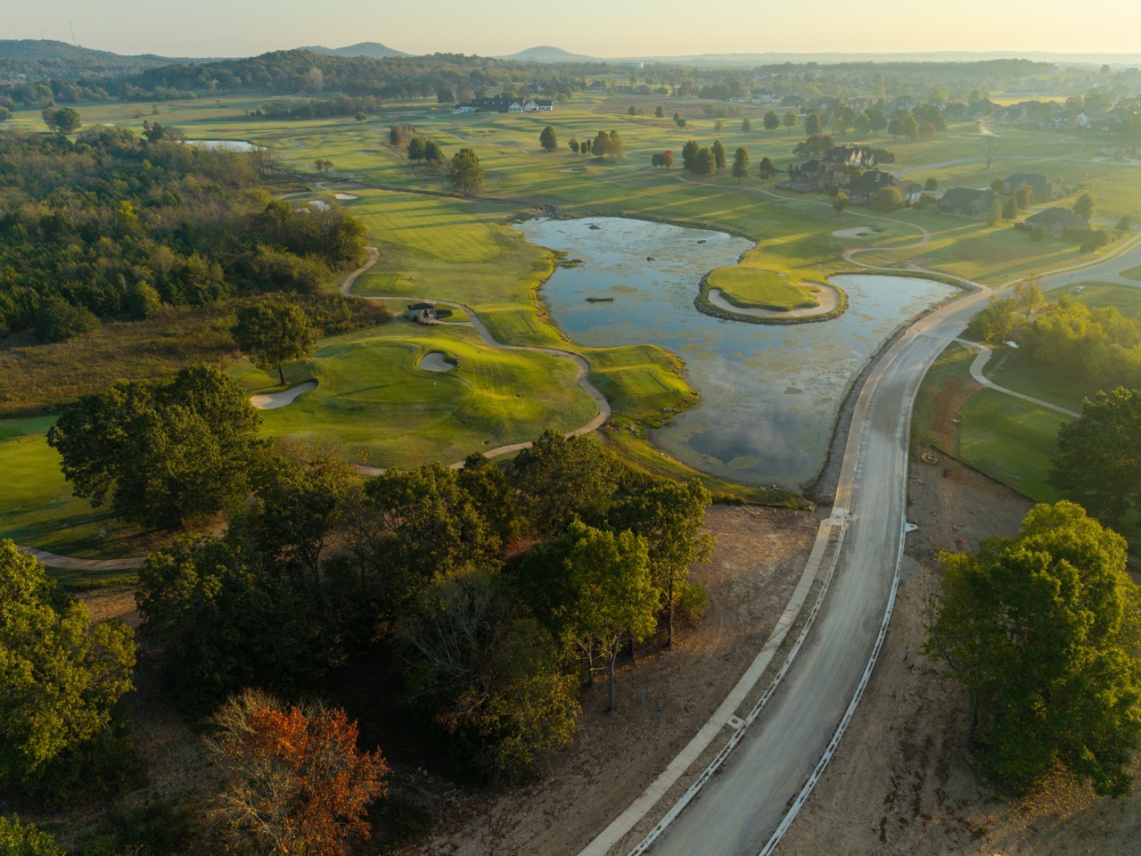Golf course with winding ponds and greens