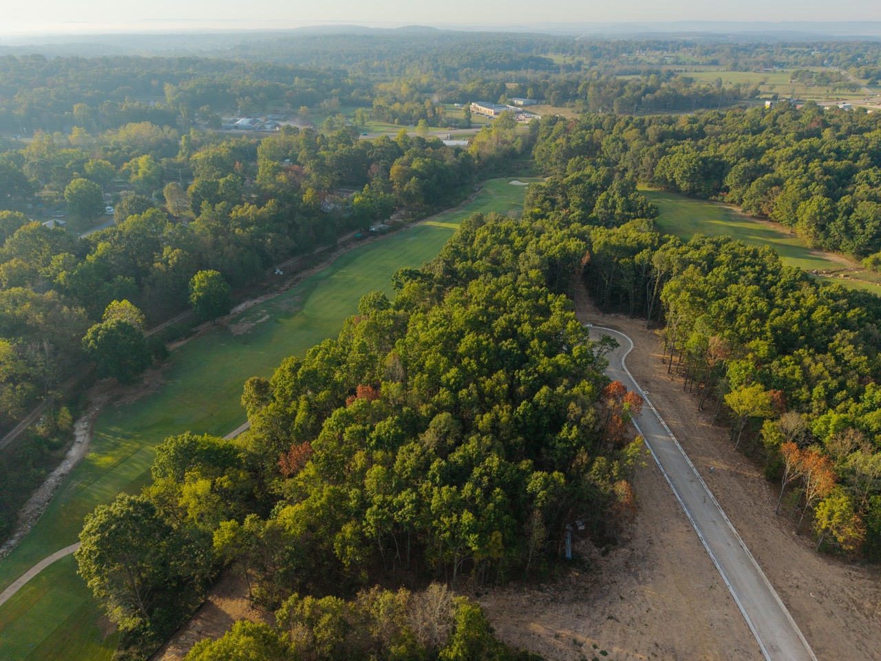 Aerial view of a tree-lined golf course