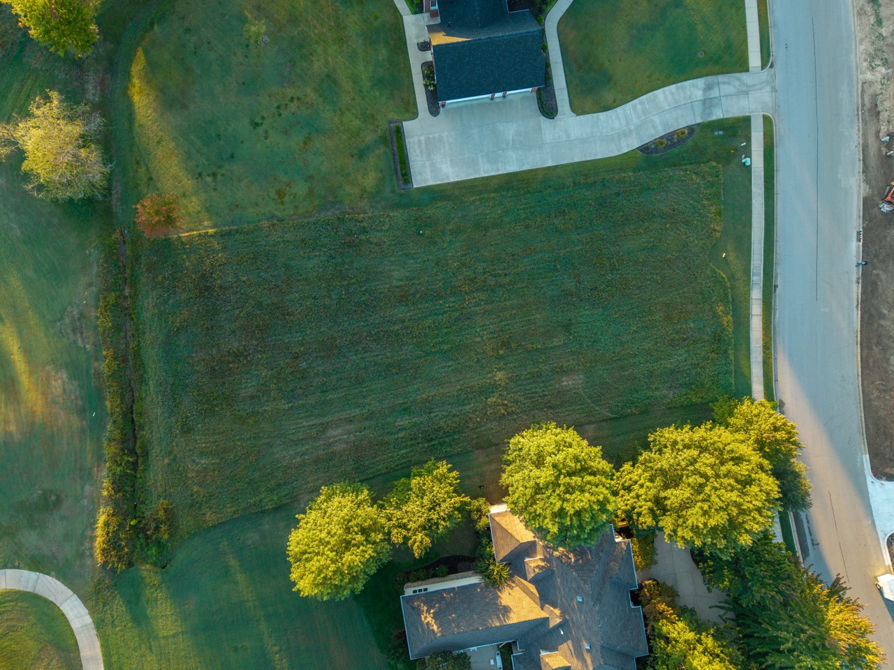 Expansive green lawn occupying central property