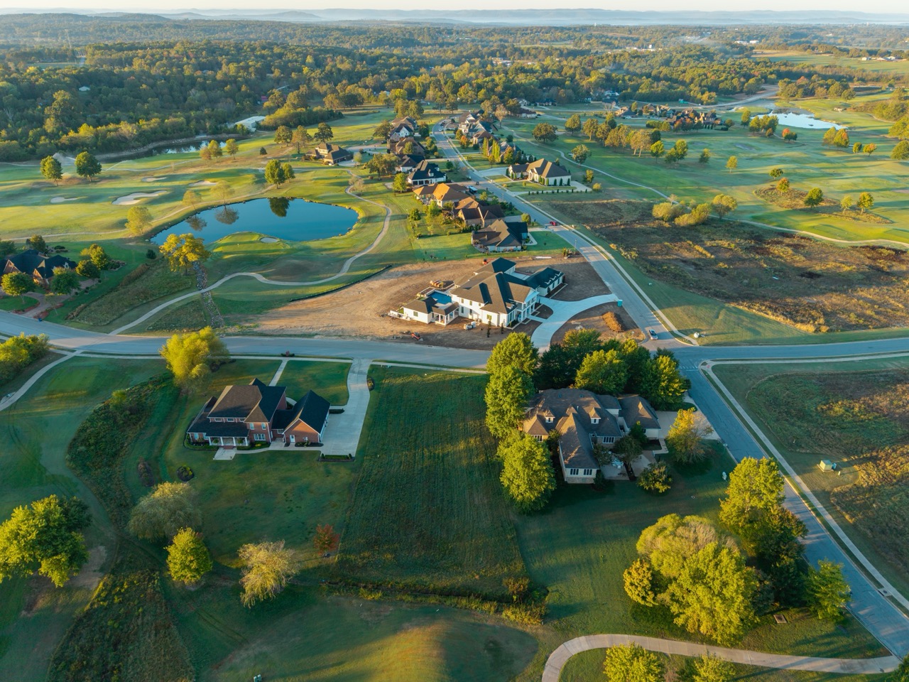 Suburban neighborhood with large houses and winding roads.