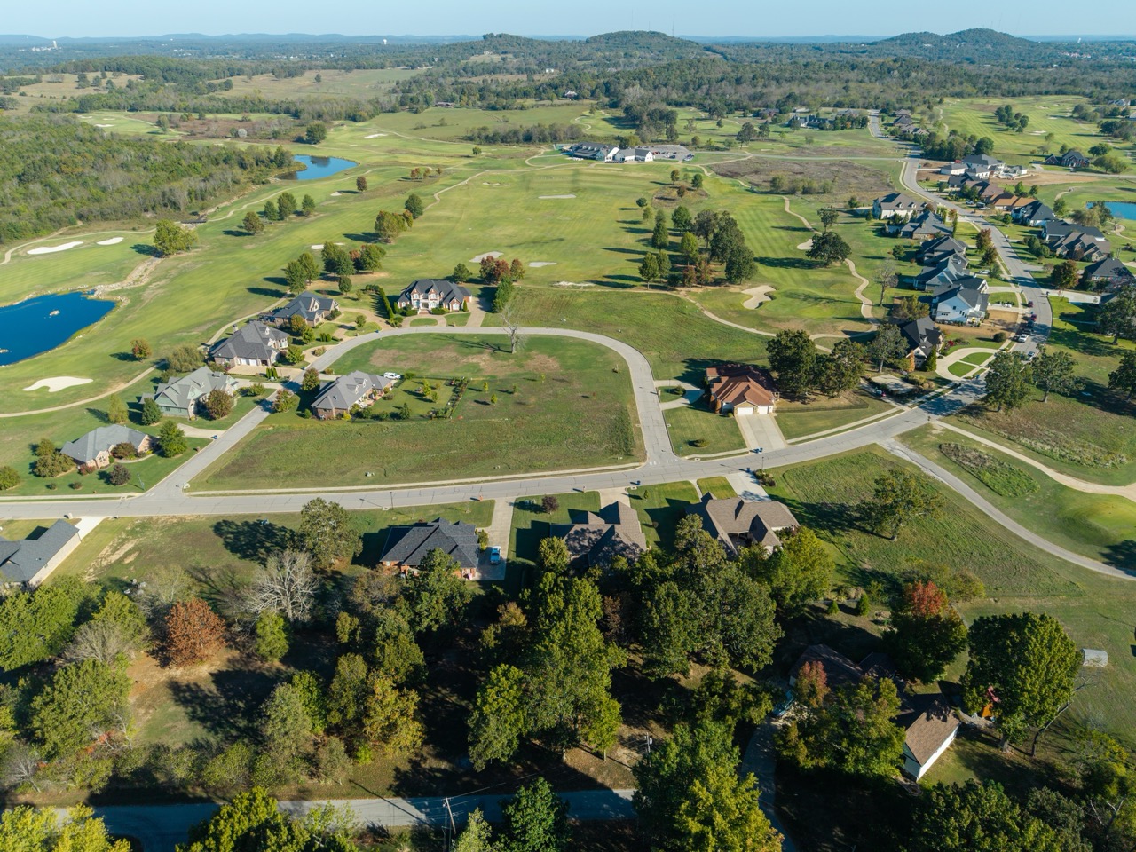 Aerial view of golf course with surrounding houses