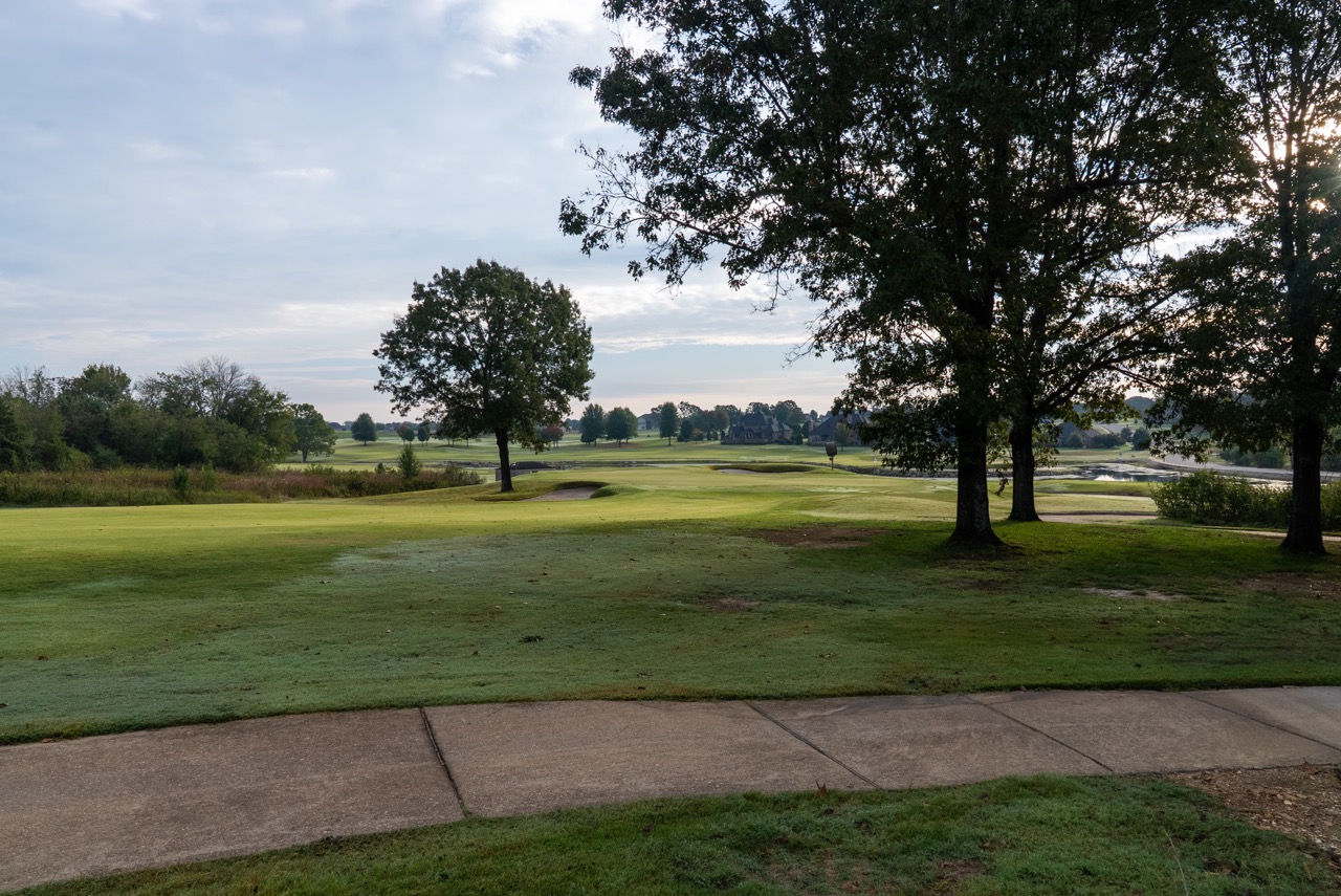 Golf course with trees and rolling fairways