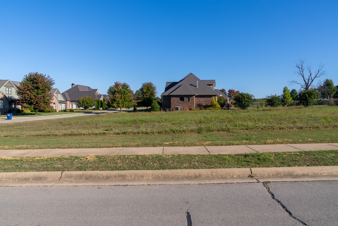 Brick house with steep gray roof.