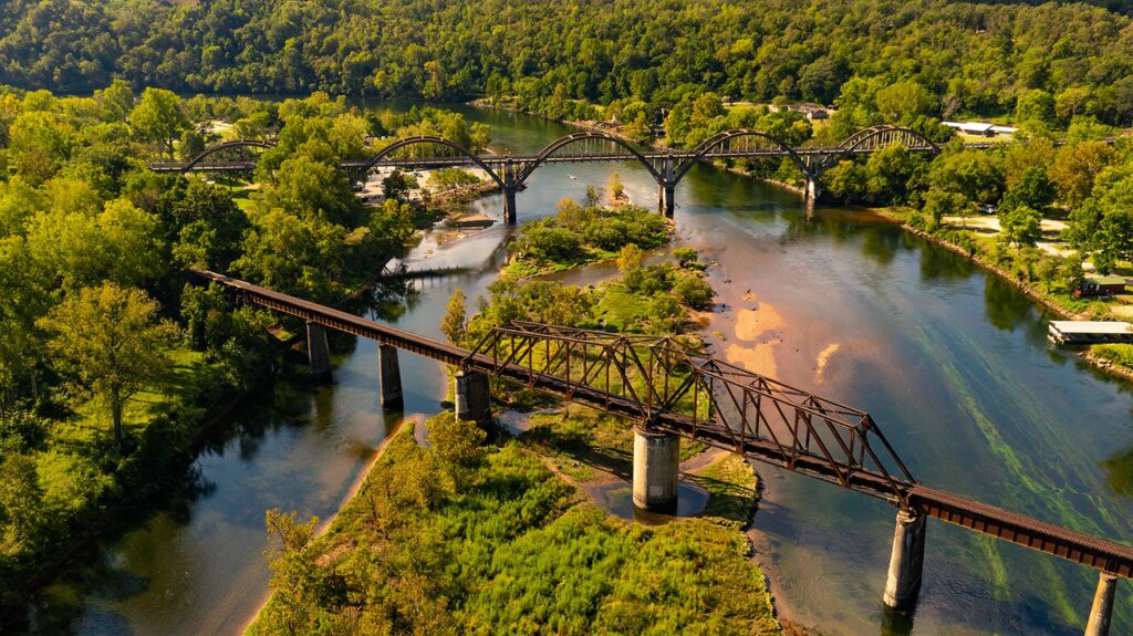 Rusted railway bridge spanning river